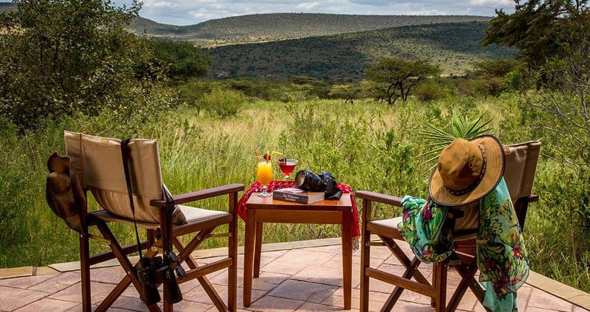 A table set for drinks in the bush as the light goes