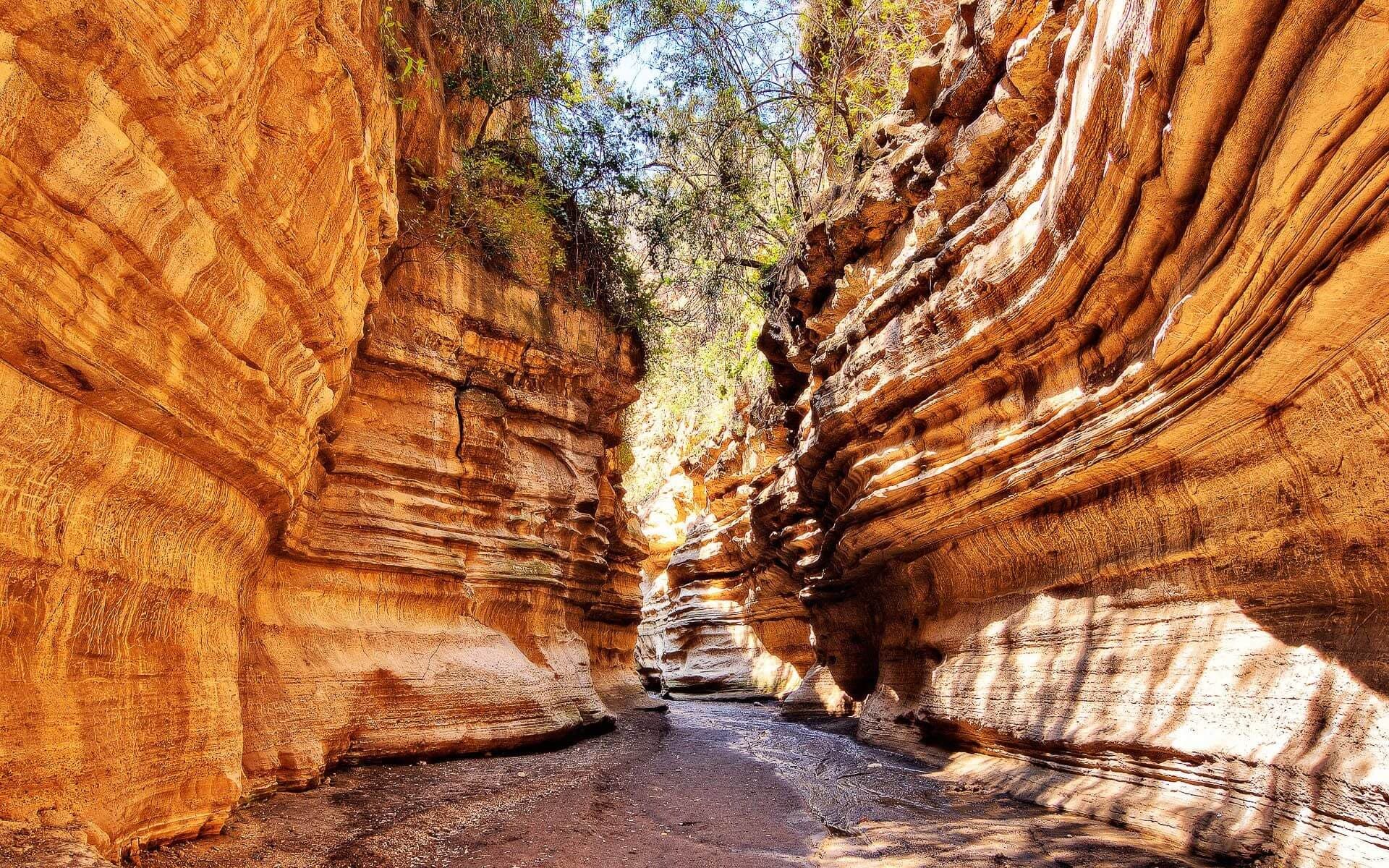 The red cliffs and open track of Hell's Gate National Park near Lake Naivasha